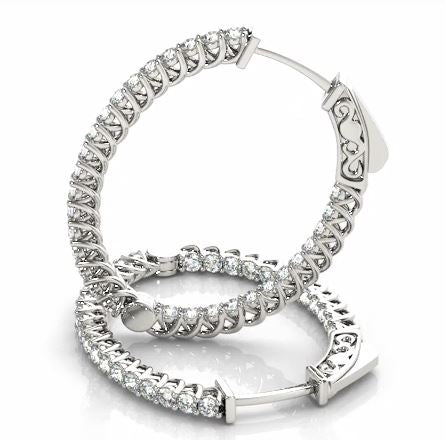 DFJ 14 Karat White Gold Diamond Oval Hoop Earrings - 1.30TWT