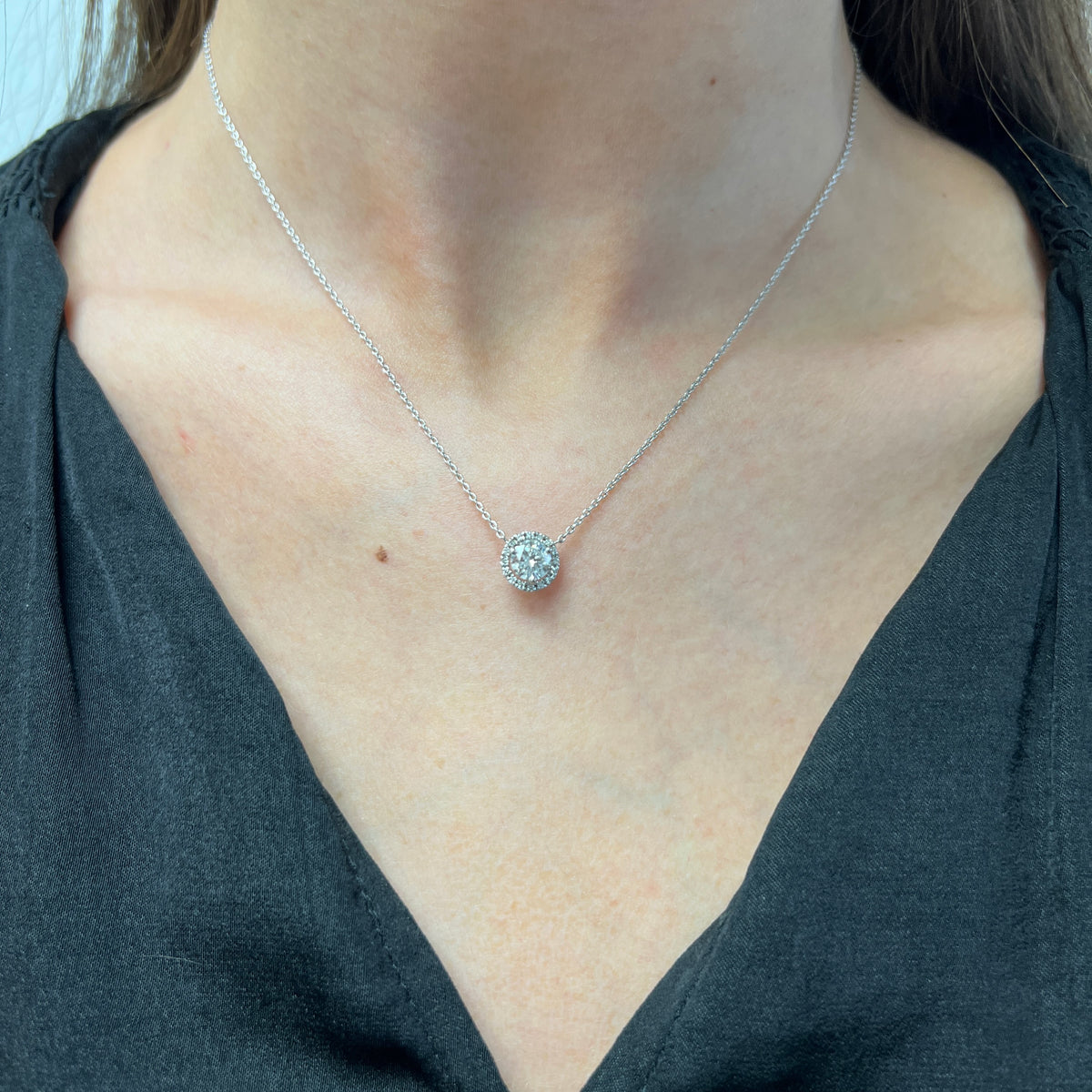 DFJ 14 Karat White Gold Round Diamond Halo Necklace 0.78tw