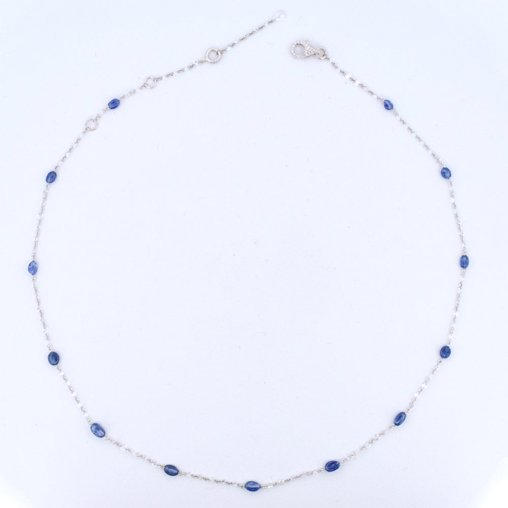 DFJ 18 Karat White Gold Floating Blue Sapphire & Diamond Necklace
